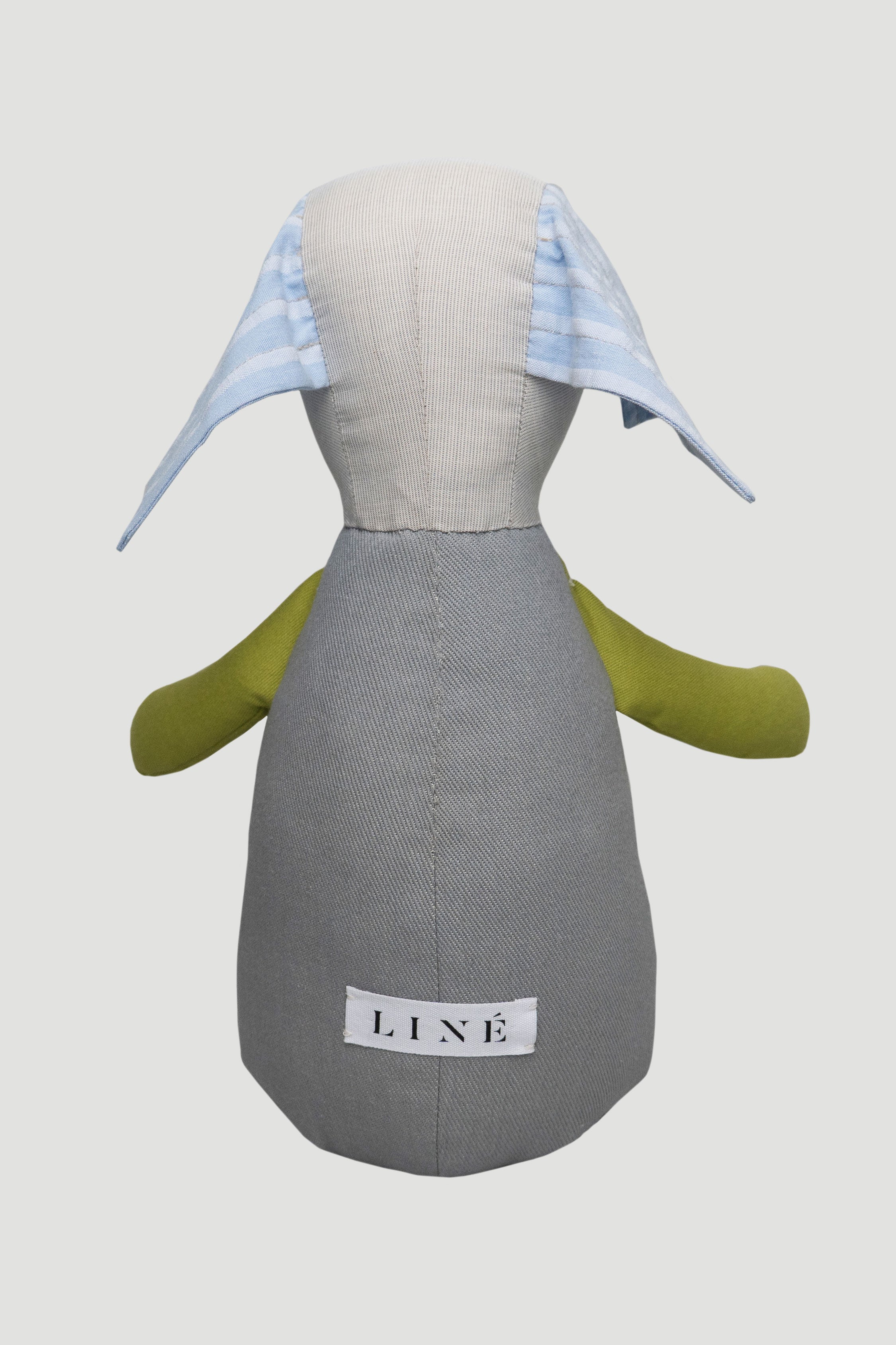 Teddy toy  with a gray body and green arms on a light gray background