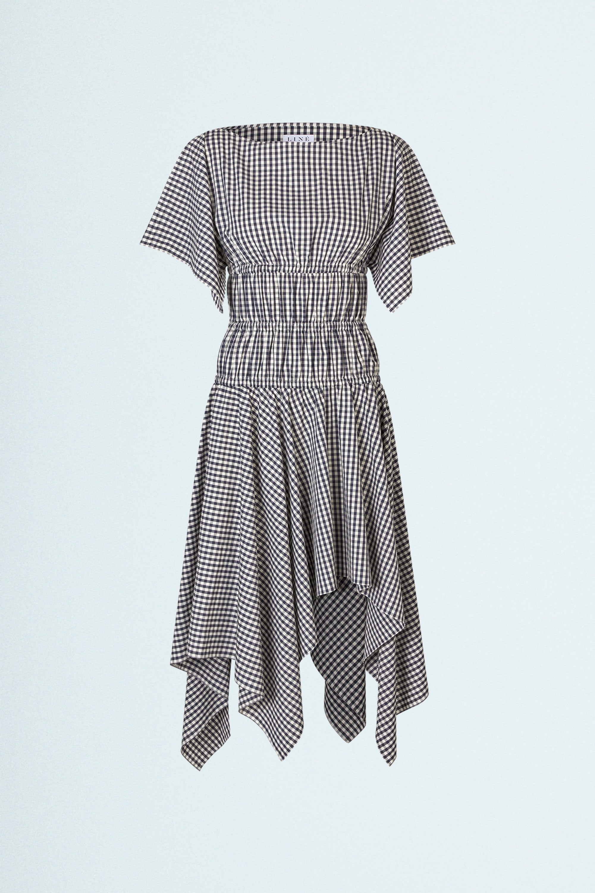 Square Dress Navy. Boat neck · Elastic casing under the bust, around waist and hips · Flared mid length sleeves · The asymmetric skirt is slightly longer in the back · Model is 162 cm and wears size 1 · Made-to-order · Produced locally in Denmark · Material: 100 % organic cotton, yarn dyed gingham · Collection: Gingham Garments. LINÉ